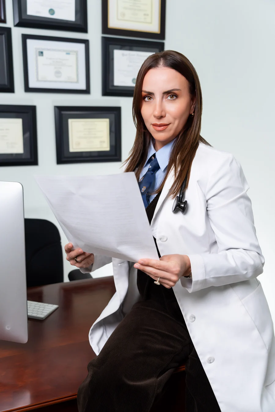 Nelli Berberyan, Board Certified Doctorate Nurse Practitioner, reviewing lab results in her clinic
